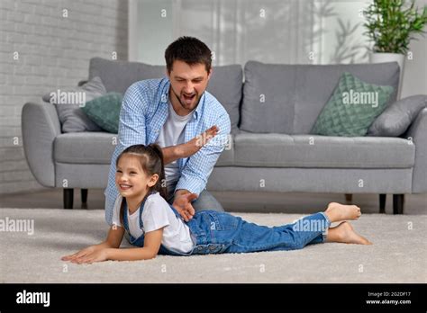 daddy daughter massage|Close up of daughter massaging her dad in bed. .